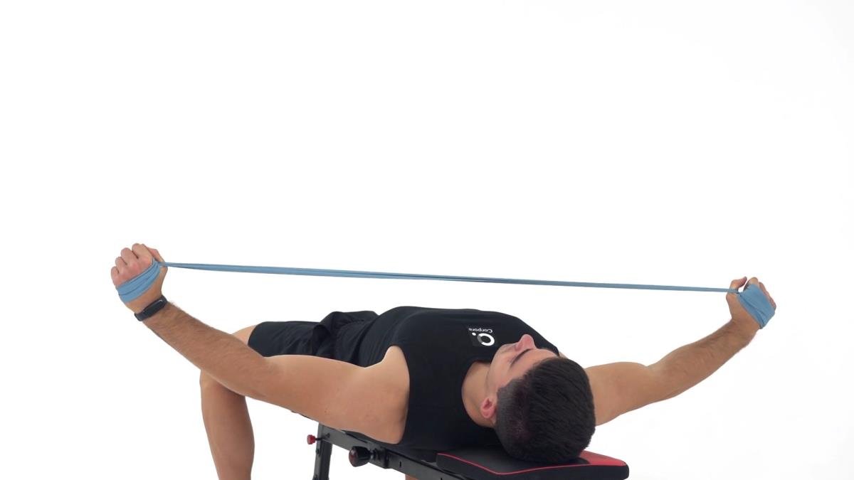 Air row con elastico, posizione supina
